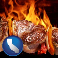 california map icon and meat on a hot barbecue grill