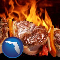 florida map icon and meat on a hot barbecue grill