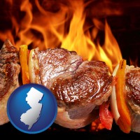 new-jersey map icon and meat on a hot barbecue grill