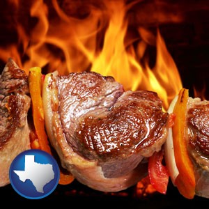 meat on a hot barbecue grill - with Texas icon